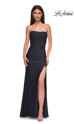 A woman models the La Femme 32931 Lace-Up Strapless Long Prom Dress, featuring a rhinestone sweetheart neckline and high slit, against a white background. The La Femme logo is displayed in the top right corner.