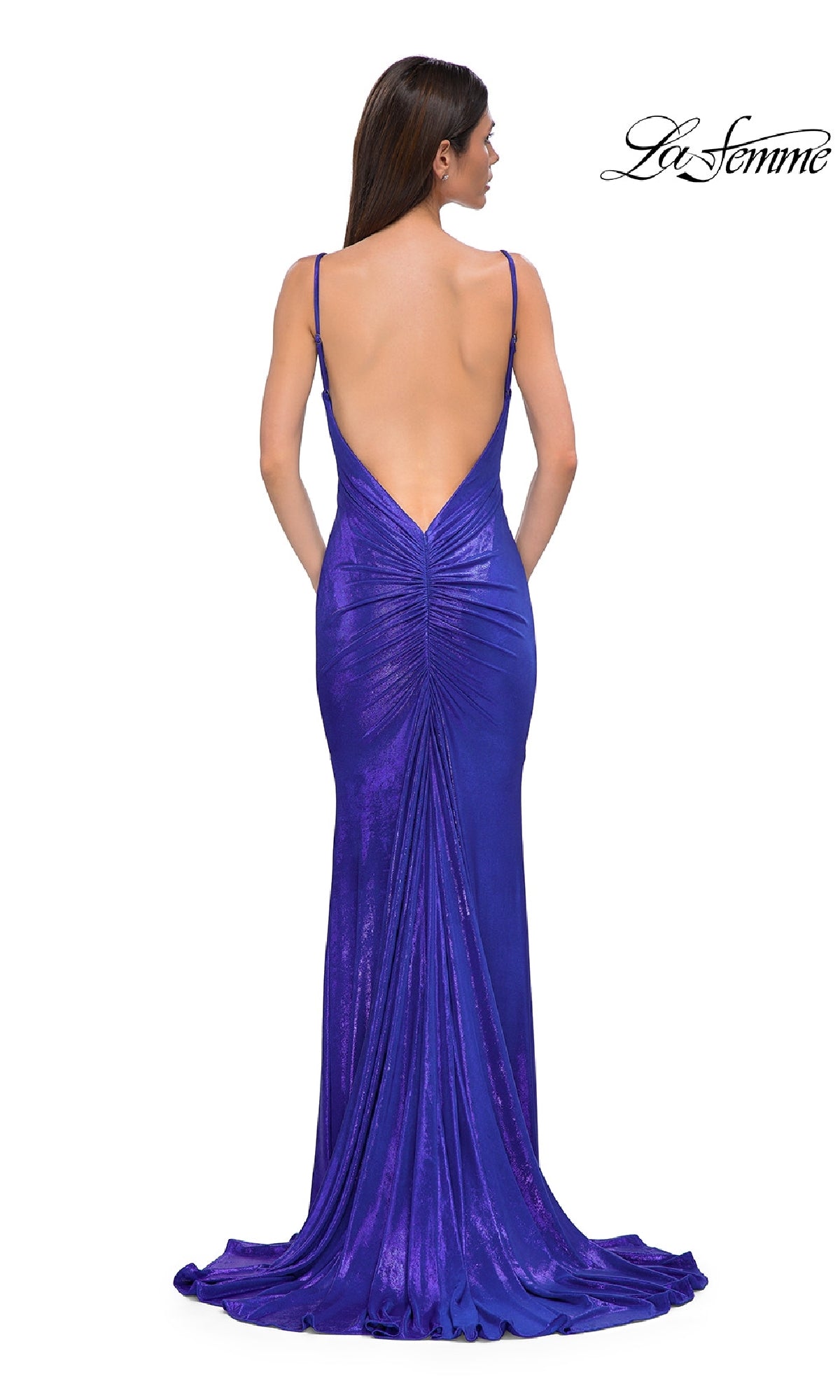 A woman faces away, wearing the La Femme 32932 Backless Long Metallic Prom Dress—a floor-length purple gown with a mermaid skirt, shimmering finish, low-cut back, and thin straps.