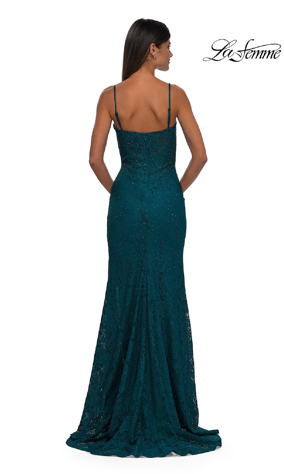 A woman faces away, wearing the Long Beaded-Lace Prom Dress La Femme 32933—a floor-length, teal gown with thin straps and a fitted silhouette.