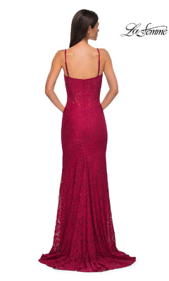 A woman faces away, wearing the La Femme 32933 Long Beaded-Lace Prom Dress in dark red with thin straps and a slight train. The La Femme logo appears in the top right corner.