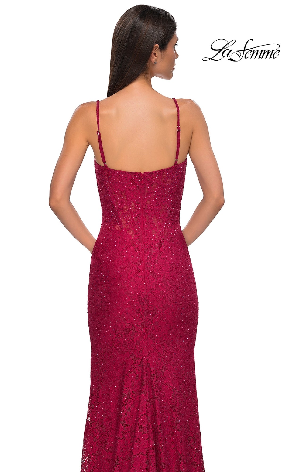 A woman is shown from the back wearing the La Femme 32933 Long Beaded-Lace Prom Dress, a fitted, sleeveless, dark red gown with thin straps and intricate lace. The La Femme logo appears in the upper right corner.