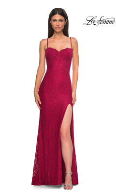 A woman poses against a white background in the La Femme 32933 Long Beaded-Lace Prom Dress—a fitted, sleeveless red gown with sequin detailing, spaghetti straps, and a high slit. The "La Femme" logo is visible in the corner.