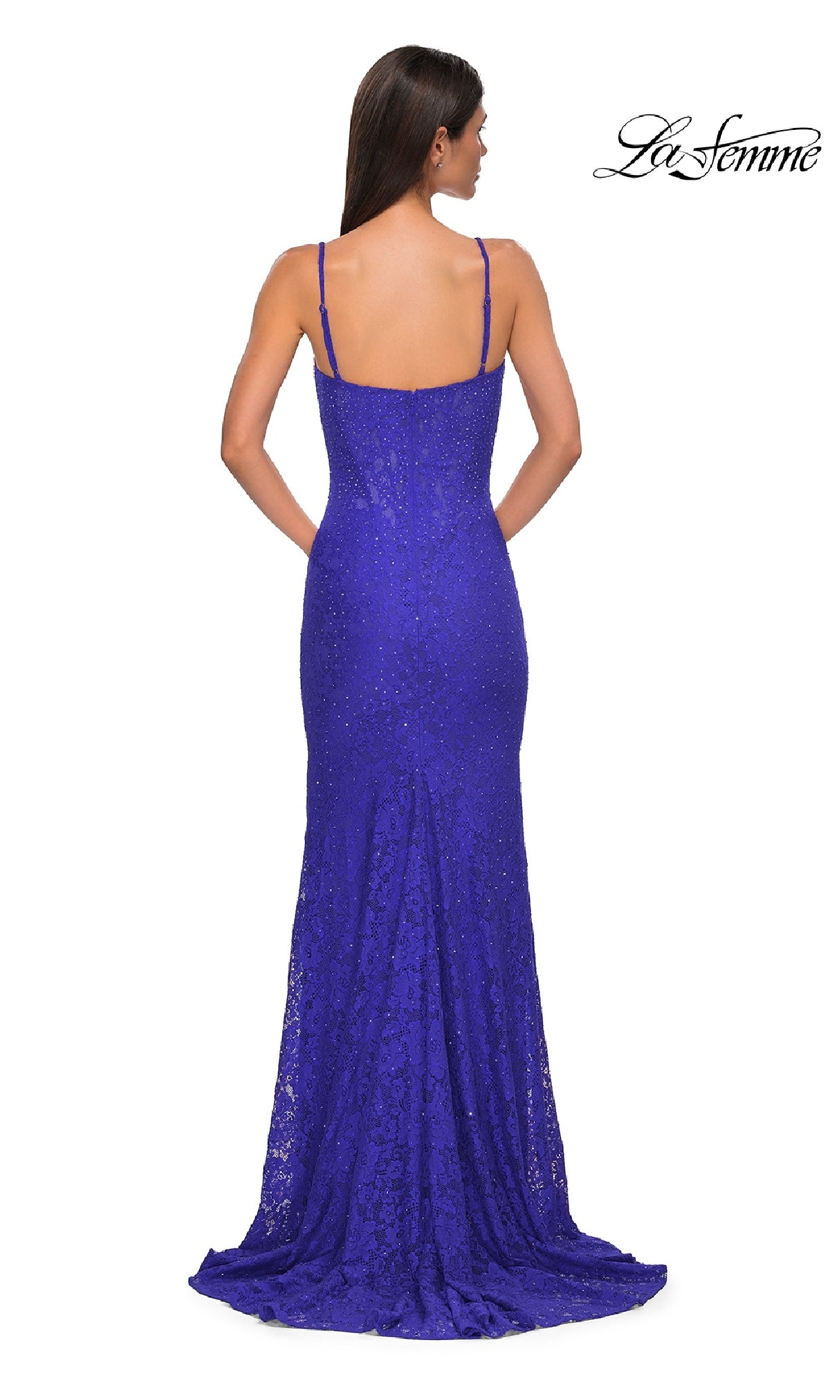 A woman is seen from the back wearing the La Femme 32933 Long Beaded-Lace Prom Dress, a fitted, floor-length blue gown with thin straps and a slight train. The brand 