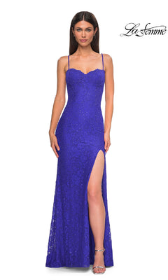 Woman in a fitted sapphire blue Long Beaded-Lace Prom Dress (La Femme 32933) featuring thin straps, a sweetheart neckline, thigh-high slit; "La Femme" logo displayed in the top right corner.