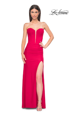 A woman wears the La Femme 32941 Strapless Deep V-Neck Prom Gown in red, featuring a fitted silhouette and high thigh slit, standing against a plain white background.