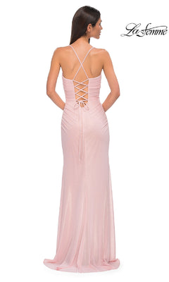 A woman faces away, wearing the La Femme 32964 long prom dress—a light pink, floor-length gown with a crisscross lace-up back and sweetheart neckline. The La Femme logo appears in the top right corner.