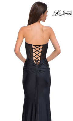 Woman wearing the La Femme 32971 Strapless Long Corset Prom Dress with a sheer corset and lace-up strapless back, standing against a plain white background.