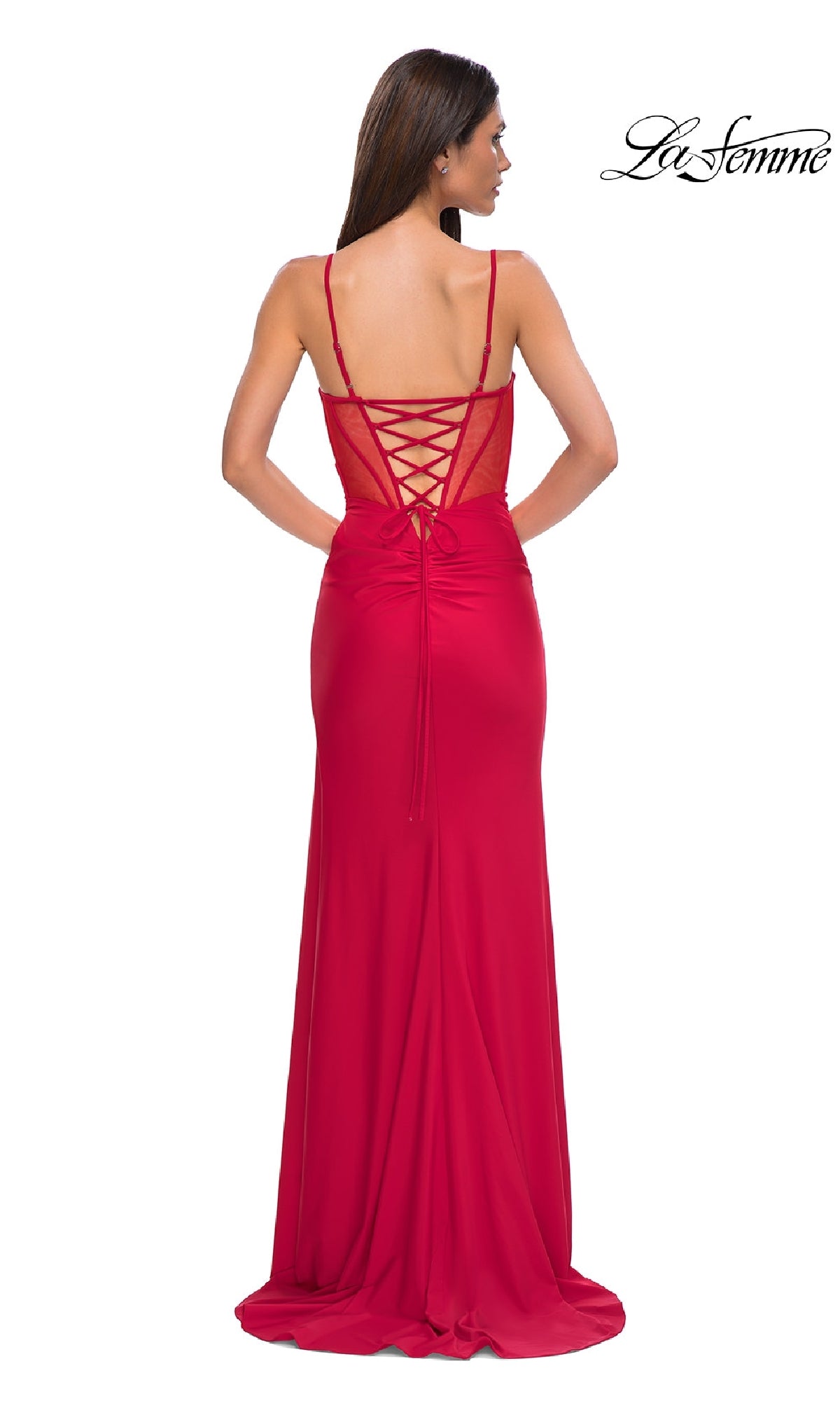 A woman stands facing away, wearing the La Femme 32977 Side-Sash Lace-Up Long Prom Dress in red. The 
