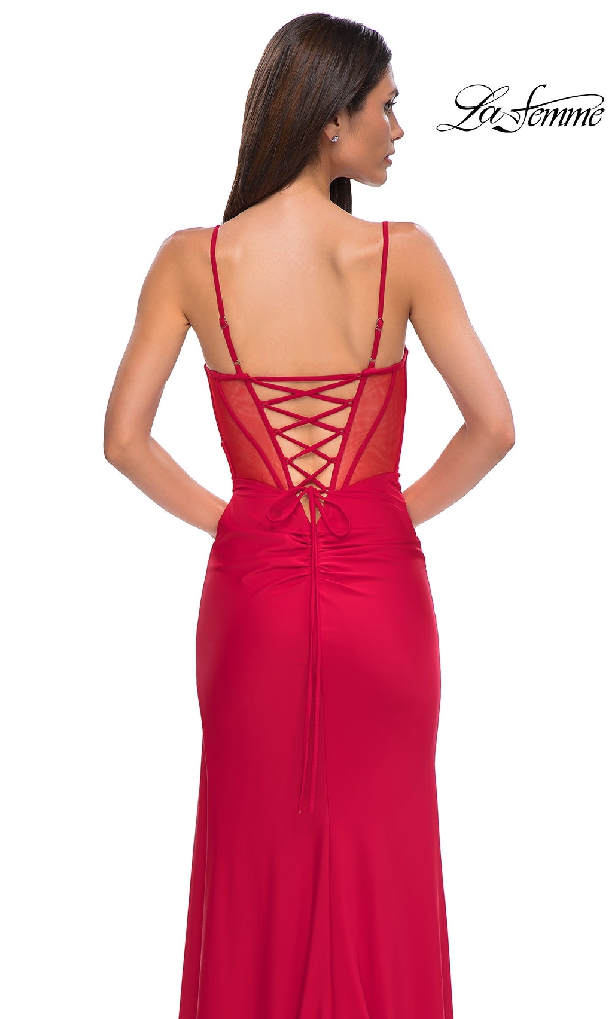 Woman wearing the La Femme 32977 Side-Sash Lace-Up Long Prom Dress, featuring spaghetti straps and a lace-up back, stands against a plain white background.