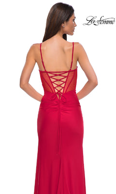 Woman wearing the La Femme 32977 Side-Sash Lace-Up Long Prom Dress, featuring spaghetti straps and a lace-up back, stands against a plain white background.
