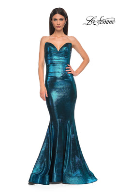 A woman models the Strapless Long Metallic Prom Dress: La Femme 32995, a metallic teal mermaid gown, against a white background with the "La Femme" logo in the top right corner.
