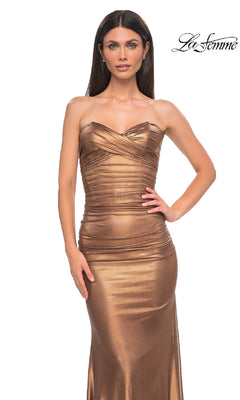 A woman poses against a white background in the Metallic Strapless Long Prom Dress: La Femme 33007, a form-fitting bronze gown with the "La Femme" logo in the top right corner.