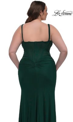 A woman is shown from the back wearing the Plus-Size Long Corset Prom Dress: La Femme 33015, a dark green fitted sleeveless formal gown with visible seam details and a zipper closure.