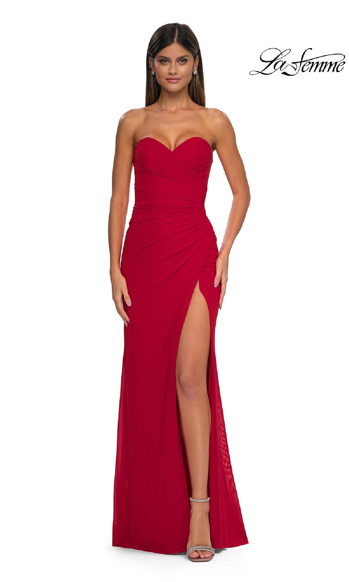 A woman wears the Lace-Up Strapless Long Prom Dress: La Femme 33018, featuring a sweetheart neckline and thigh-high slit, standing against a white background. The La Femme logo appears in the top right corner.