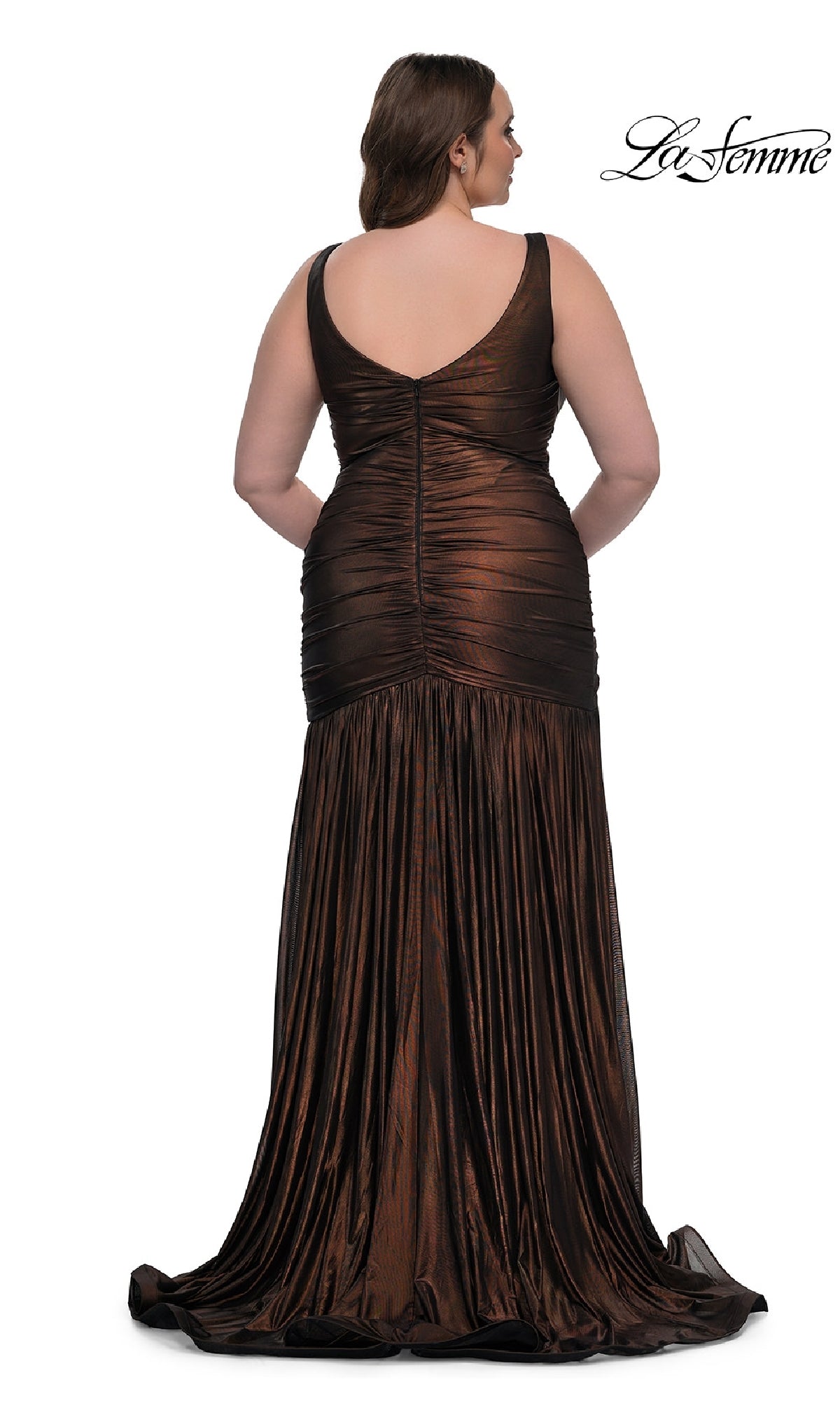 A woman models the Long Plus-Size Prom Dress La Femme 33021, a sleeveless metallic brown gown with a v-neck and ruching, shown from the back. The La Femme logo is visible in the top right corner.