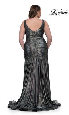 A woman models the La Femme 33021 long plus-size prom dress, featuring a sleeveless v-neckline, deep V-back, metallic ruched fitted bodice, and flared floor-length skirt. "La Femme" appears in the top right corner.