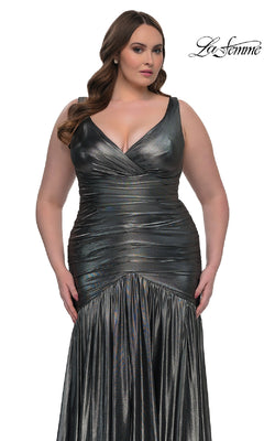 A woman models the La Femme 33021, a long plus-size metallic ruched prom dress with a sleeveless v-neck and fitted waist, against a white background. The "La Femme" logo is shown in the top right corner.