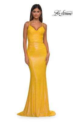 A woman stands facing forward in the Tight Long Metallic Prom Dress: La Femme 33034, a yellow, floor-length bodycon dress with thin straps. The background is plain white with the "La Femme" logo in the top right corner.