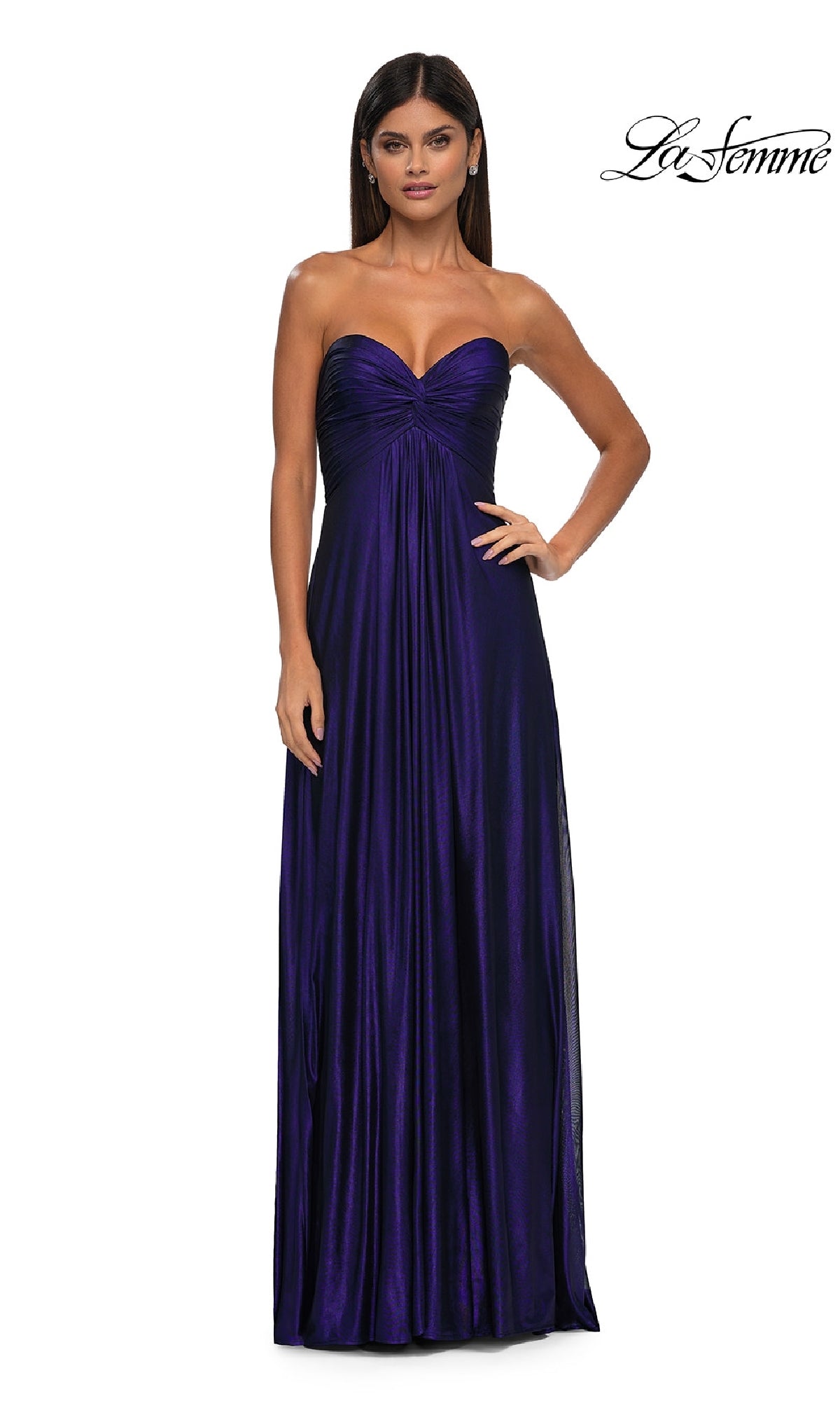 A woman stands facing forward against a plain white background, wearing the La Femme 33047: a strapless, floor-length metallic prom dress with a sweetheart neckline in deep purple.