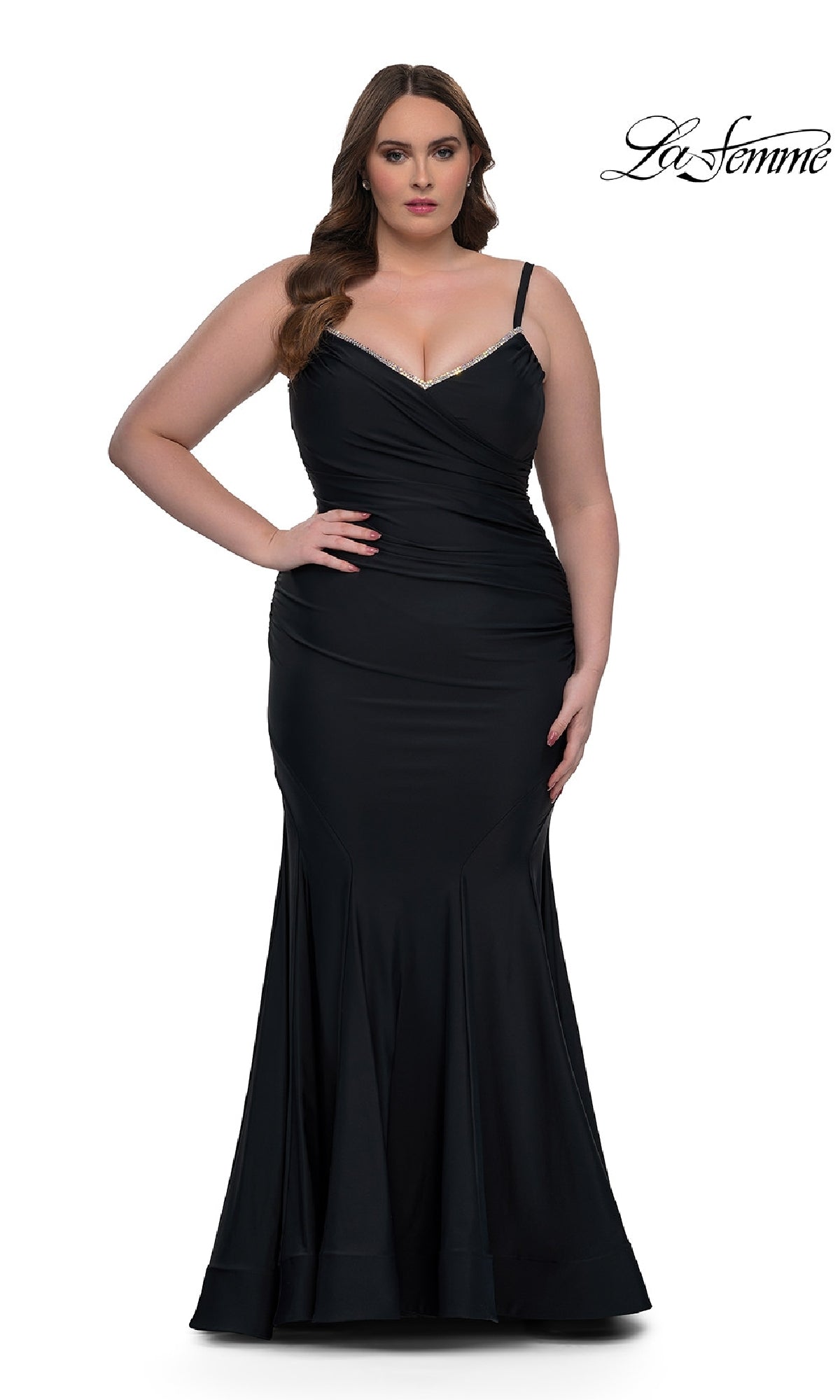 A woman in a sleeveless, floor-length black Plus-Size Prom Dress: La Femme 33057 with a fitted silhouette stands against a white background. The La Femme logo appears in the top right corner.