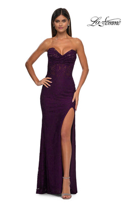 A woman poses elegantly against a plain white background in the Strapless Long Lace Prom Dress: La Femme 33069, featuring a fitted silhouette, sweetheart neckline, sequin details, and thigh-high slit.