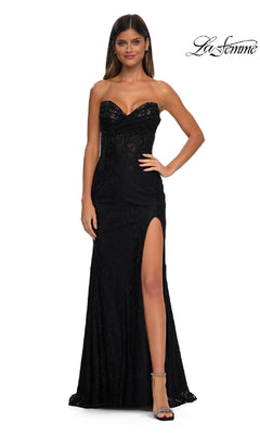 A woman stands against a white background wearing the La Femme 33069, a strapless long lace prom dress featuring a sweetheart neckline, sheer bodice, and high-thigh slit.