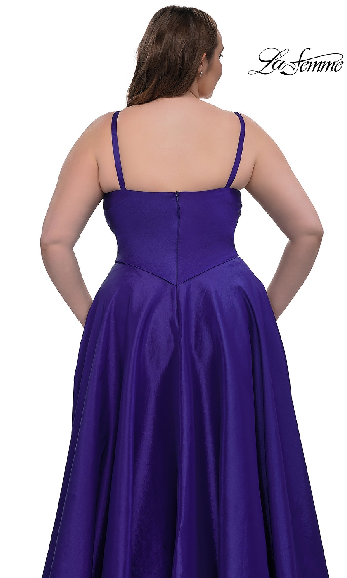 A woman is shown from the back wearing the La Femme 33075, a sleeveless, floor-length purple plus-size prom dress with an a-line skirt, against a white backdrop. The 