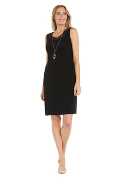 Woman wearing the Petite Two-Piece Party Dress: R&M Richards 3312, styled with a long necklace and nude heels, standing against a white background.
