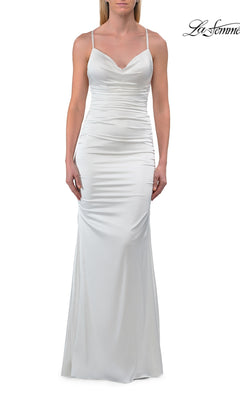 An elegant woman wears the La Femme 33193 low open-back long prom dress in ivory, featuring a chic cowl neckline, delicate thin straps, fitted waist, and a slight flare at the hem. The La Femme logo appears in the top right corner, highlighting this stunning sleeveless satin gown.