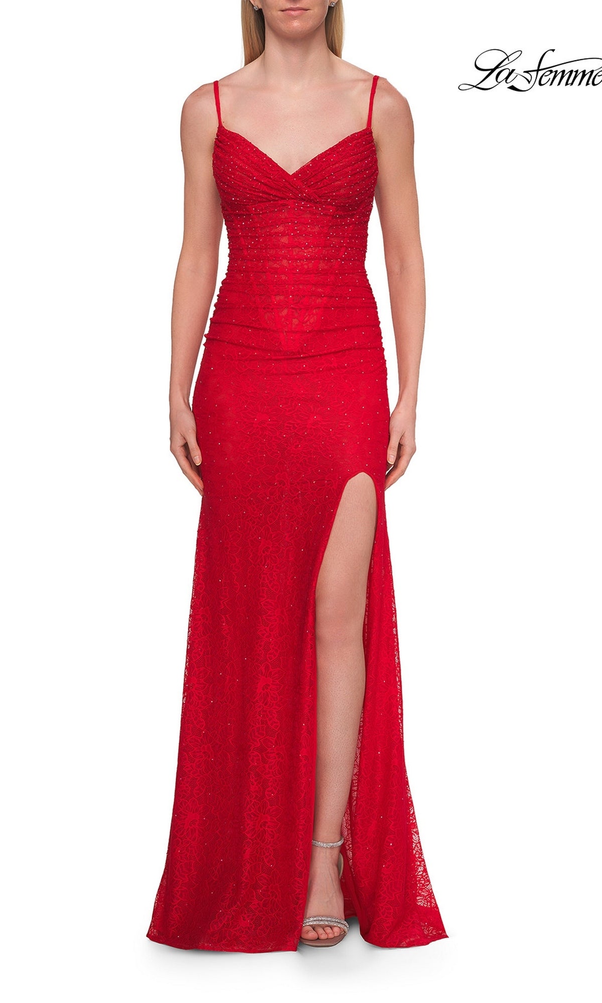 Model wearing the La Femme 33305 long prom dress in red, featuring a sleeveless design with spaghetti straps, a gathered bodice, delicate corset detailing, beaded accents, and a high slit. She completes the look with silver heels. The La Femme logo appears in the top right corner.