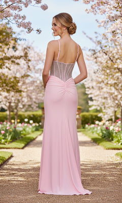 Wearing the Beaded-Corset Long Prom Dress: La Femme 33357, a woman stands on a garden path lined with blooming cherry blossoms, facing away from the camera.