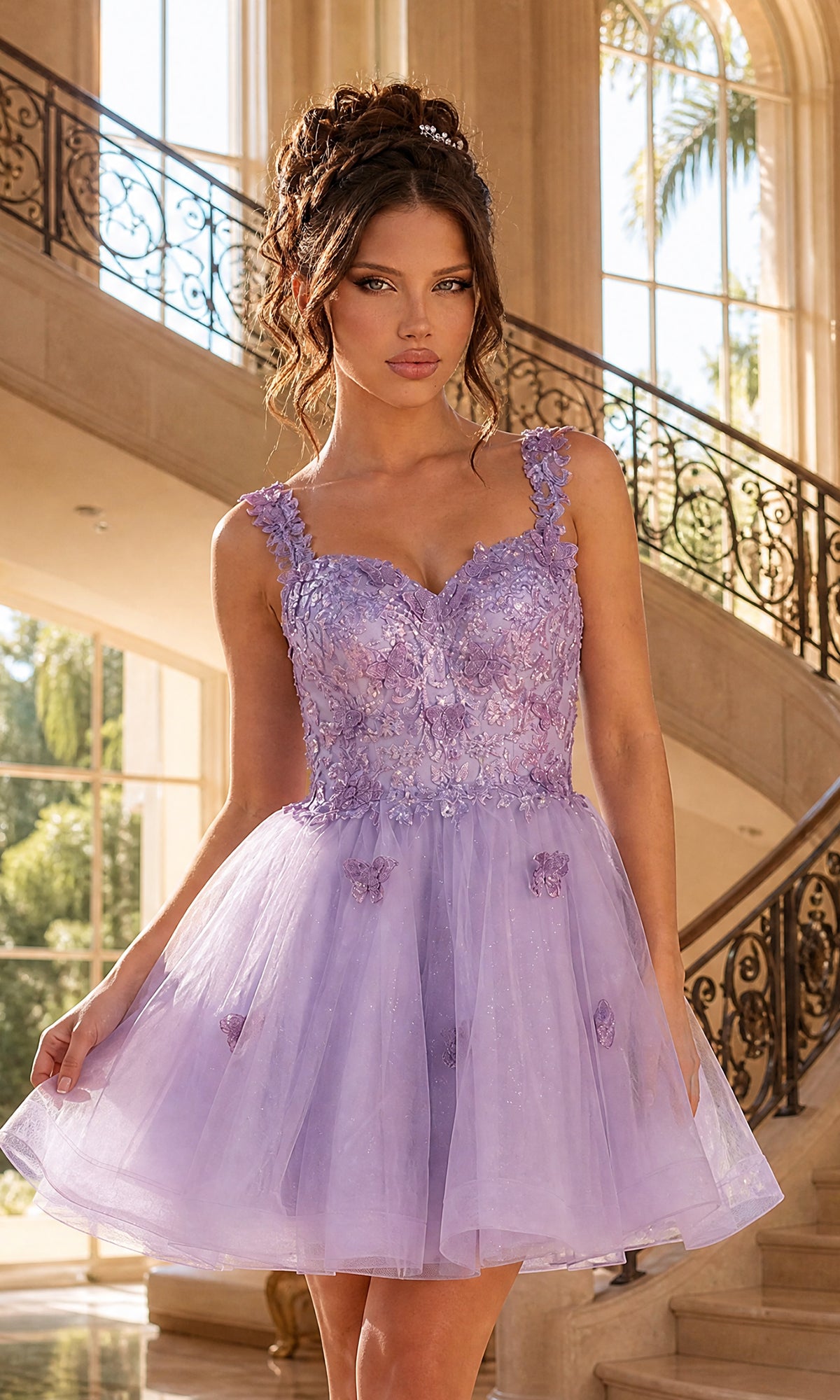 A woman stands indoors in the Embroidered-Lace Short Babydoll Hoco Dress 3338 in lilac, featuring floral embellishments and a fitted bodice, with a grand staircase and large windows in the background.