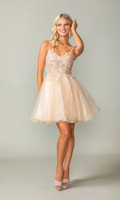 A woman smiles on a plain background, wearing the Lace-Up Short Butterfly Homecoming Dress 3341 featuring a sleeveless light beige lace bodice and a tulle skirt.