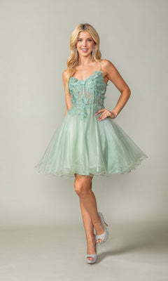 Smiling woman wearing the Lace-Up Short Butterfly Homecoming Dress 3341 in light green, featuring a knee-length flared tulle skirt and floral lace detailing, stands against a plain background.