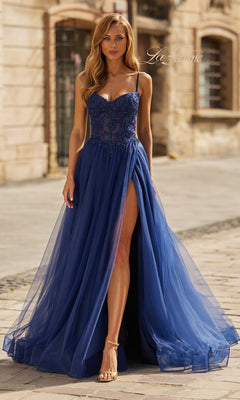A woman walks outdoors on a stone path wearing the La Femme 33436 Long Prom Dress in marine blue, featuring an embellished corset bodice and a high leg slit.