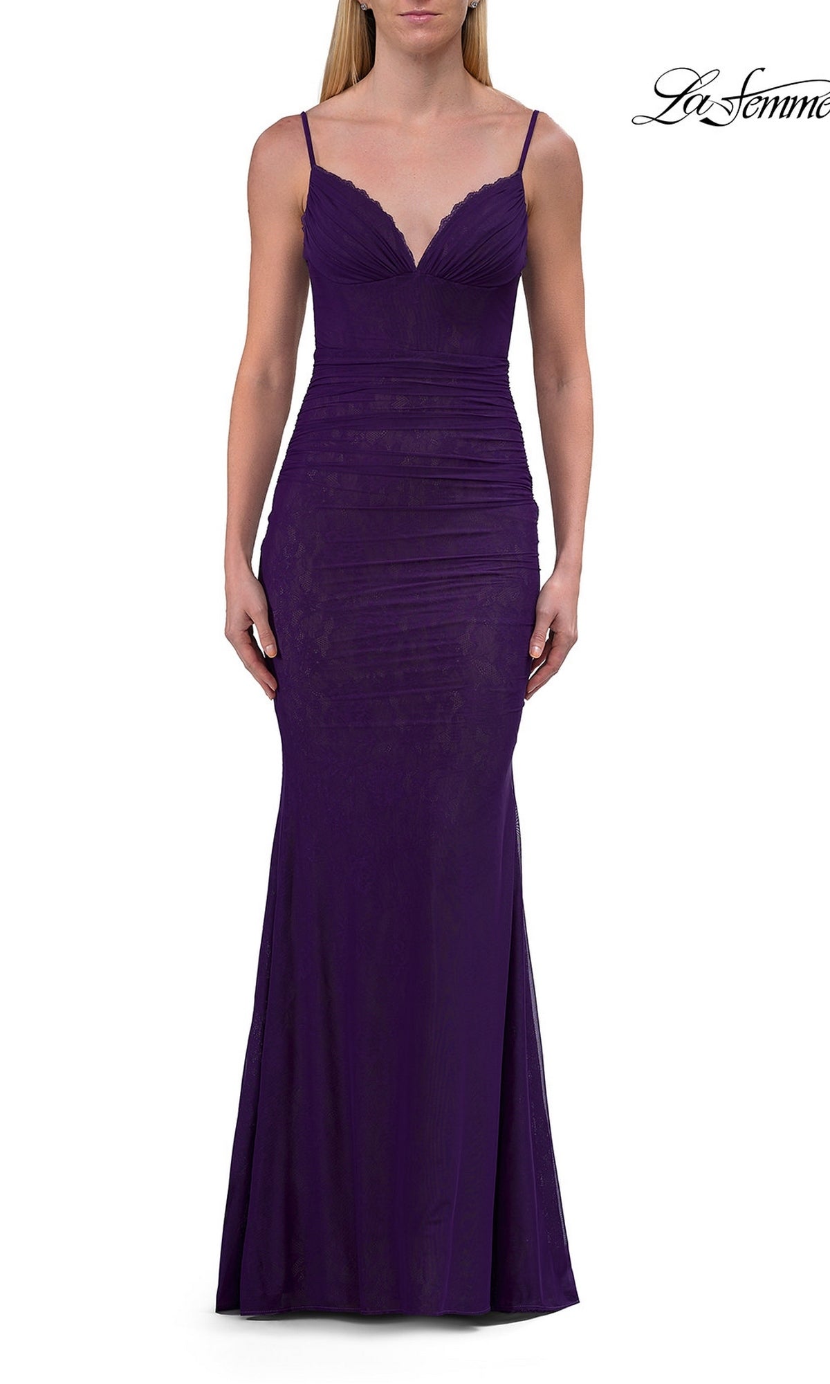 A woman wearing the La Femme 33443 Simple Long Lace Prom Dress in royal purple, a floor-length fitted designer gown featuring thin straps, slight ruching at the waist, a V-neckline, and a sleeveless silhouette.