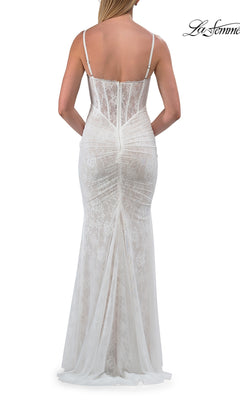 A woman is shown from the back against a plain white background wearing the Simple Long Lace Prom Dress: La Femme 33443, featuring thin straps and a fitted bodice.