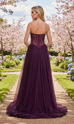 A woman stands outdoors on a garden path lined with cherry blossoms, wearing the La Femme 33491 Strapless Sheer-Corset Prom Gown with an embroidered corset back.
