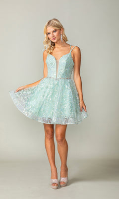 A woman poses against a plain backdrop in the Three-D Short Butterfly Homecoming Dress 3350—a light blue, sleeveless dress featuring a corset-style bodice and flared skirt—paired with high-heeled shoes.