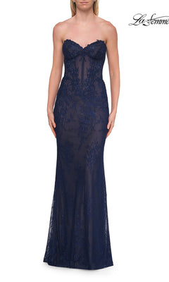 A woman wearing the Strapless Long Lace Prom Dress: La Femme 33518 in marine blue, featuring a strapless sweetheart neckline with sheer beaded floral lace and delicate beading details, fitted through the bodice and hips.