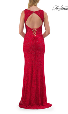 A woman stands facing away from the camera, wearing the La Femme 33519—a sleeveless red lace prom dress featuring an elegant lace-up open back and a floor-length hem.