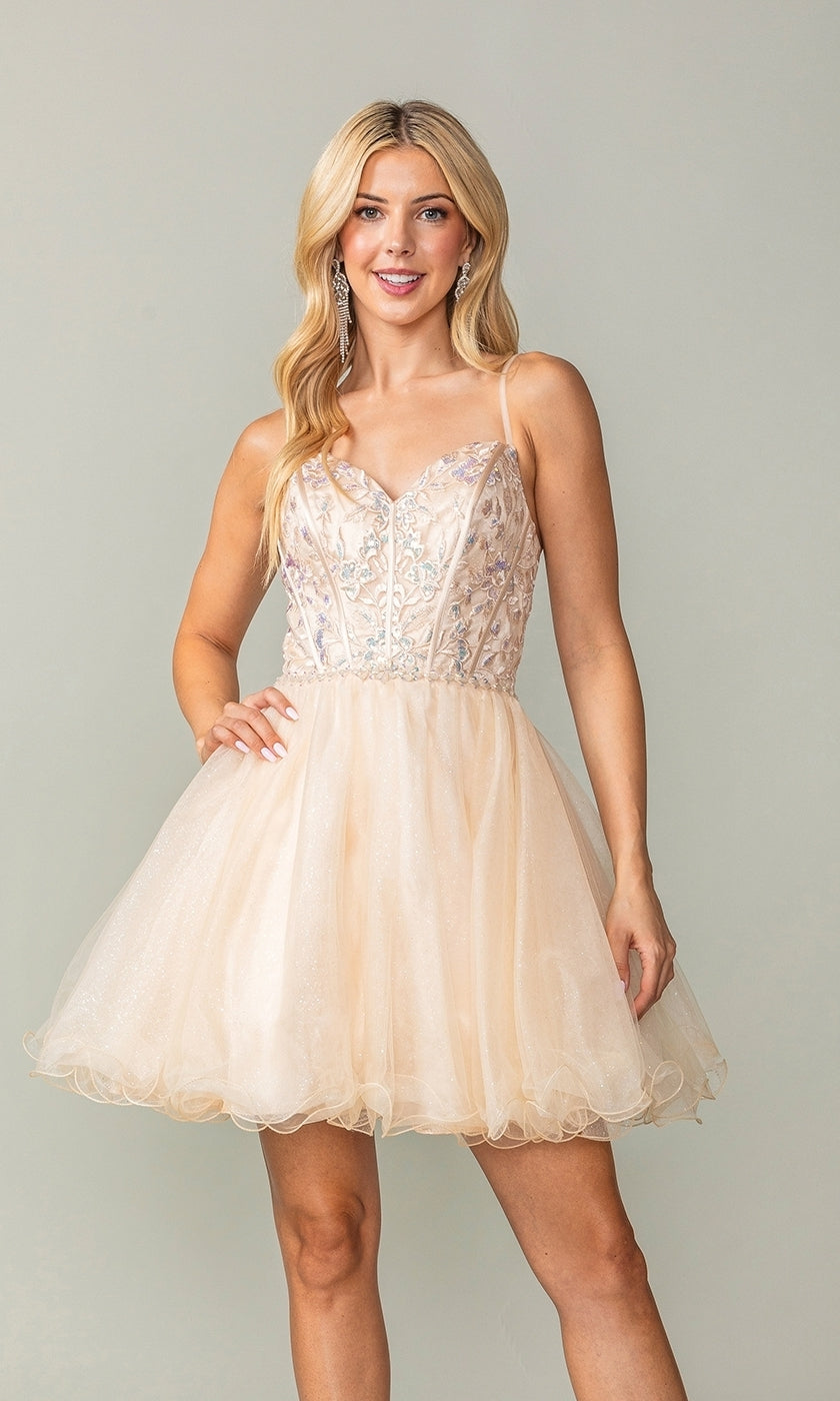 Woman wearing the Lace-Up Short Babydoll Homecoming Dress 3352—a light peach, sleeveless party dress with floral embroidery and a corset-style bodice—posing against a plain background.