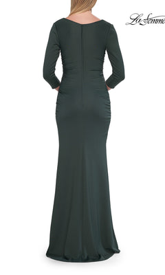 A woman wearing the La Femme 33540 three-quarter-sleeve formal gown in a floor-length dark green design, shown from the back with a fitted silhouette and ruched detailing—an elegant option for mothers of the bride seeking a sophisticated long formal dress.