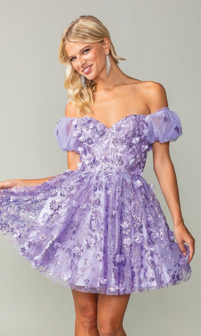 A woman smiles while holding out one side of the Short Sleeve Short Glitter Homecoming Dress 3355, featuring off-the-shoulder sheer puff sleeves and sparkling floral sequin details.