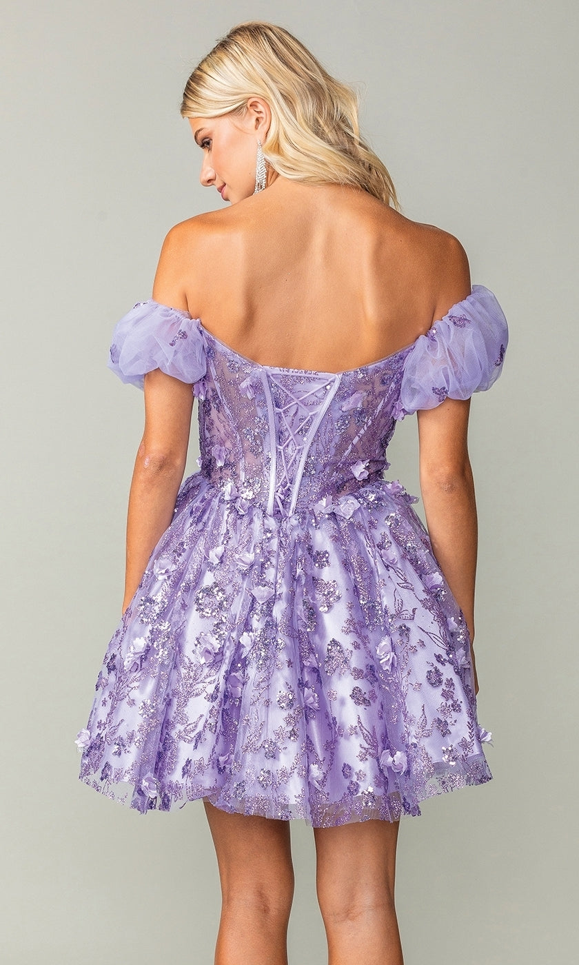 A woman is shown from the back wearing the Short Sleeve Short Glitter Homecoming Dress 3355 in lavender, featuring off-the-shoulder puff sleeves and floral embellishments.