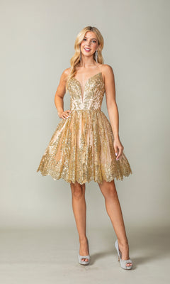 A woman poses in the Scallop Hem Short Glitter Homecoming Dress 3358—a sleeveless, gold sequin dress with a deep V-neckline and sheer overlay—paired with silver high heels against a plain background.