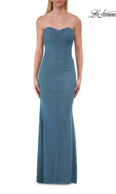 A woman wearing the Classic Strapless Long Prom Dress: La Femme 33601—a slate blue, floor-length, fitted gown with subtle ruching and a hint of sparkle—stands against a plain white background.
