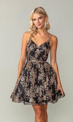 A woman stands against a plain light gray background wearing the Short A-Line Glitter-Print Homecoming Dress 3360—a sleeveless, V-neck, black and gold semi-formal dress featuring a flared skirt and floral lace details.