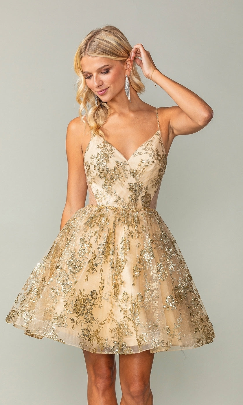 A woman models the Short A-Line Glitter-Print Homecoming Dress 3360, featuring gold floral patterns, spaghetti straps, and a V-neckline, standing against a plain background.