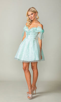 A woman models the Shoulder-Bow Short Glitter Homecoming Dress 3363, featuring tulle sleeves and a corset lace-up back, paired with sparkly high heels against a plain light backdrop.